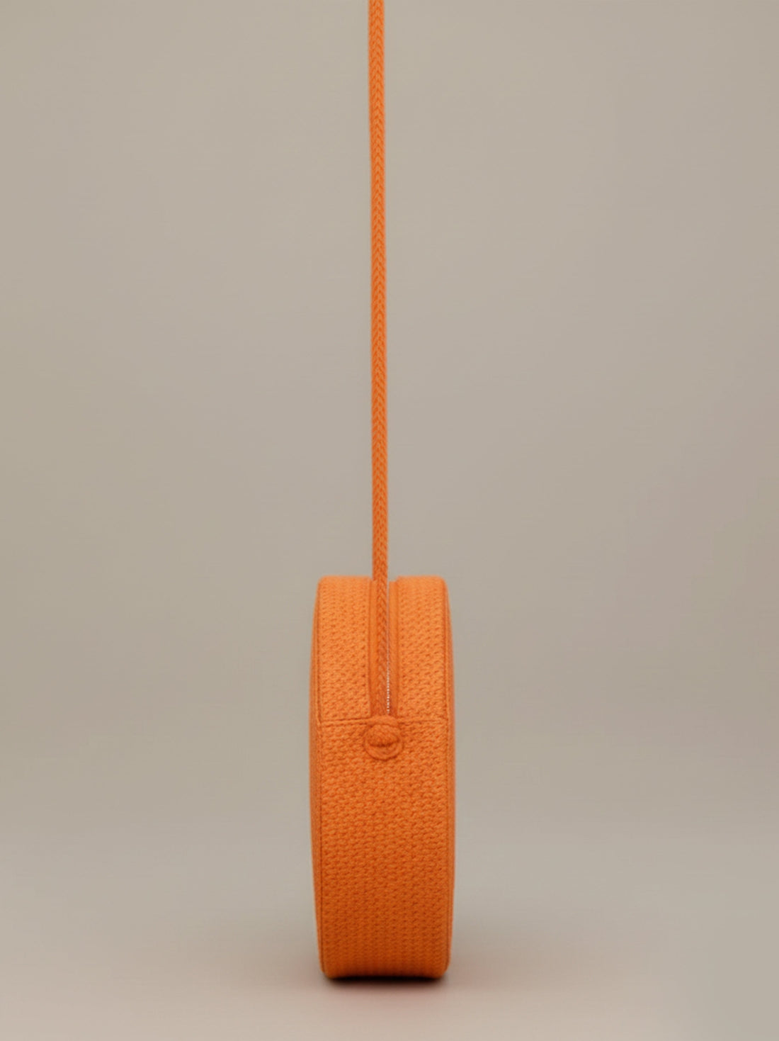 Sac bandoulière rond tressé